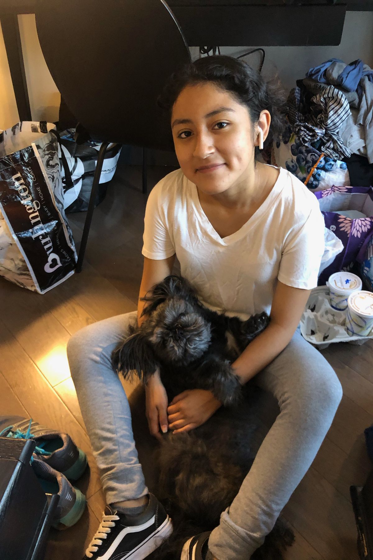 16-year old Kimberly Sinchi has been staying with her dog, Tango, and her parents at a hotel room in downtown Brooklyn after they were displaced by a fire from their Jackson Heights apartment.