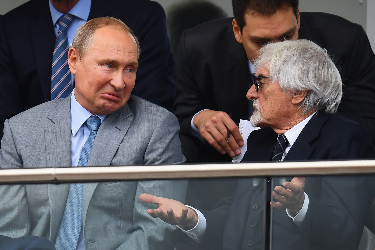 Russia President Vladimir Putin and Bernie Ecclestone, Chairman Emeritus of the Formula One Group, talk during the Formula One Grand Prix of Russia at Sochi Autodrom on September 30, 2018 in Sochi, Russia.