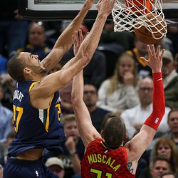 Utah Jazz center Rudy Gobert (27) dunks on Atlanta Hawks forward Mike Muscala (31) during the game at Vivint Smart Home Arena in Salt Lake City on Tuesday, March 20, 2018.