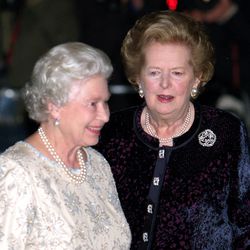FILE - Queen Elizabeth of Britain is greeted by Margaret Thatcher, right, at the former British Prime Minister  Thatcher's 80th birthday party in Central London. Thatchers former spokesman, Tim Bell, said that the former British Prime Minister Margaret Thatcher died Monday morning, April 8, 2013, of a stroke. She was 87.