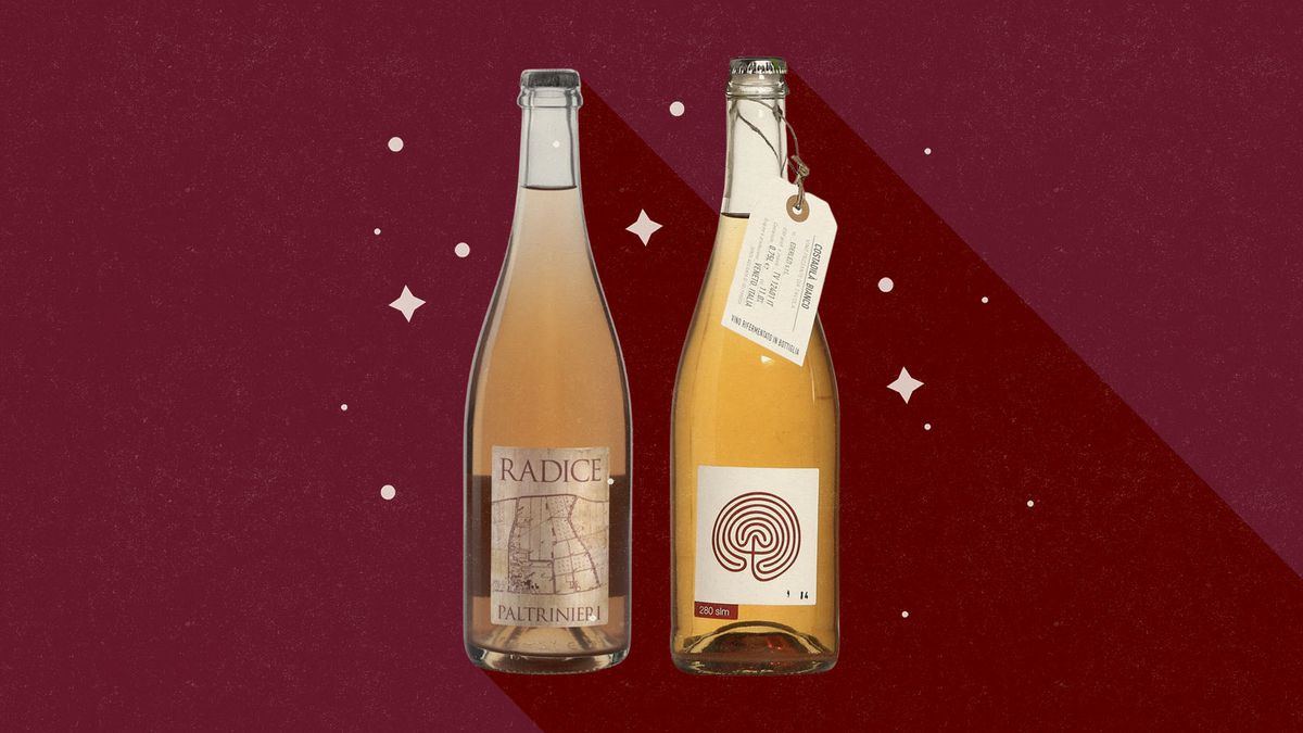Two bottles of sparkling wine on a red background, surrounded by stars.