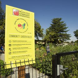 A sign lists the rules for the Liberty Wells Community Garden on 1700 South and 700 East in Salt Lake City on Tuesday, Aug. 30, 2016. The community garden provides plots for 44 gardeners.