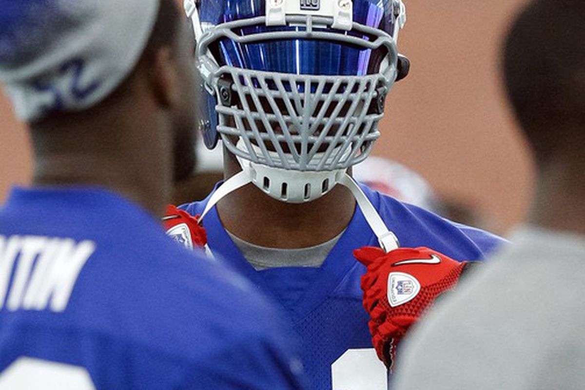 Jun 14, 2012; East Rutherford, NJ, USA;   New York Giants defensive end Justin Tuck (91) shows off his new facemask during mini-camp. Jim O'Connor-US PRESSWIRE