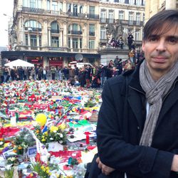 Emmanuel Foulon, one of the organisers of a march in memory of the victims of the recent attacks, speaks to the Associated Press in the Place de La Bourse in the centre of Brussels, Saturday, March 26, 2016. The Belgian government asked for the march on Sunday to be postponed so that police resources can be allocated in the hunt for the attackers involved in Tuesday's bomb blast at the airport and a metro station in Brussels, and the oraganisers of the march later agreed. 