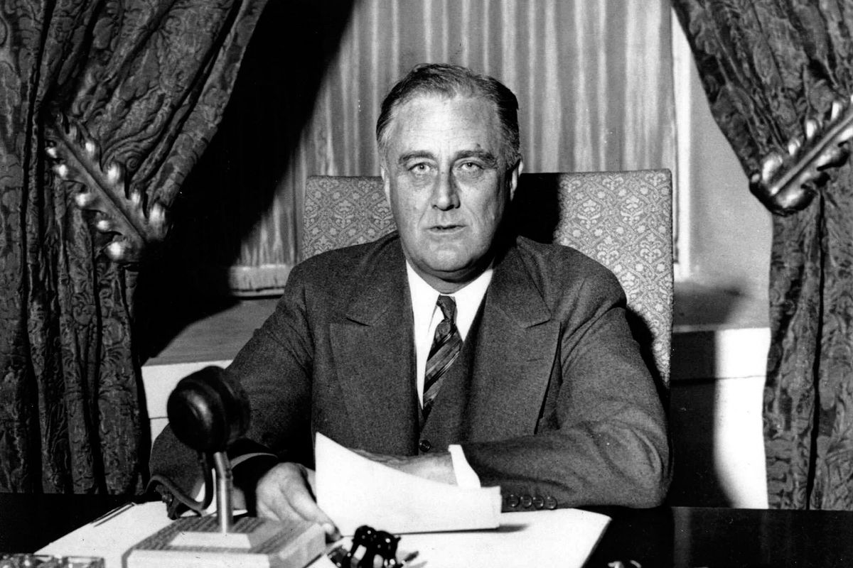 Franklin Delano Roosevelt (1882-1945), 32nd President of the United States of America 1933-1945, giving one of his ‘fireside’ broadcasts to the American nation during.