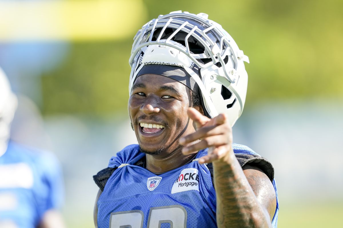 Jamaal Williams #30 of the Detroit Lions laughs during the Detroit Lions Training Camp at the Lions Headquarters and Training Facility on July 29, 2022 in Allen Park, Michigan.