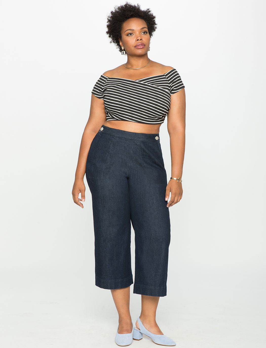 A model in culottes and a striped crop top