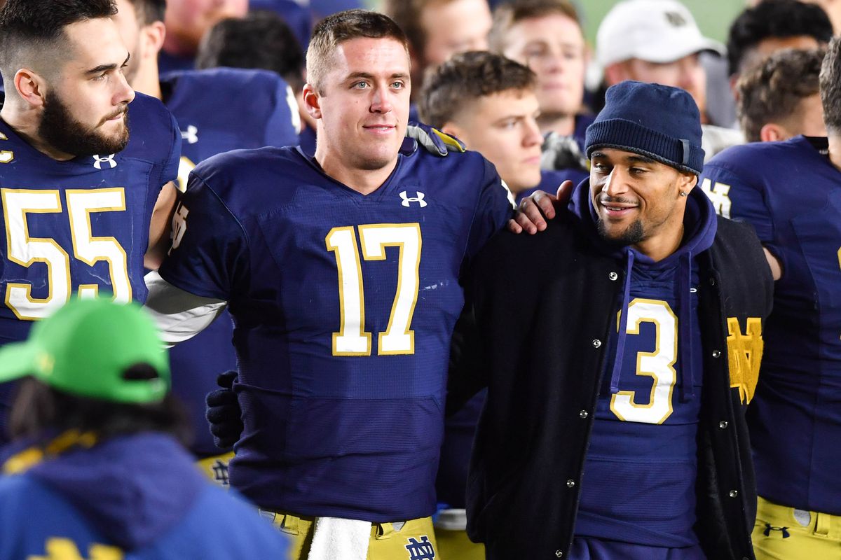Notre Dame Fighting Irish quarterback Jack Coan (17) joins his teammates for the Notre Dame Alma Mater following the 55-0 win over the Georgia Tech Yellow Jackets at Notre Dame Stadium.