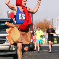 Nick Peterson, aka The Gobbler, runs in the USANA Turkey Trot 5K in Salt Lake City, Thursday, Nov. 6, 2014. He placed second. USANA employees donated more than 800 pounds of food to the Utah Food Bank.