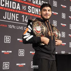 Dillon Danis tries on Darrion Caldwell and Rory Macdonald’s championship belts