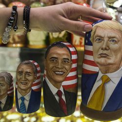FILE - In this Tuesday, Nov. 8, 2016 file photo, traditional Russian wooden nesting dolls called Matreska depicting U.S. presidents, from left, George H.W. Bush, Bill Clinton, George W. Bush, Barack Obama and U.S. presidential candidate Donald Trump, are displayed in a shop in Moscow, Russia. Hacked emails, disclosed by WikiLeaks, revealed at-times embarrassing details from Democratic Party operatives in run-up to Election Day, leading to the resignation of Democratic National Committee chair Debbie Wasserman Schultz and other DNC officials. The CIA later concluded that Russia was behind the DNC hacking in a bid to boost Donald Trump's chances of beating Hillary Clinton. 
