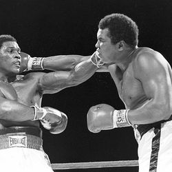 Trevor Berbick, left, and Muhammad Ali seem to have an equal reach as they slug it out during a Friday night boxing match in this  Dec. 12, 1981 file photo in Nassau, Bahamas.   Berbick, who lost his heavyweight title to Mike Tyson and was the last boxer to fight Muhammad Ali, was found dead Saturday, Oct. 28, 2006, in a church courtyard in Kingston, Jamaica, police said. 