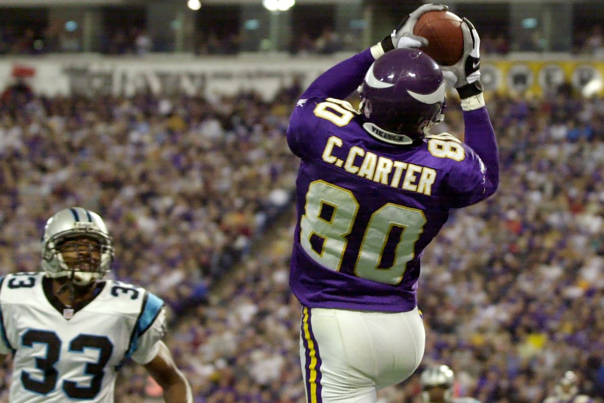 Minnesota Vikings Cris Carter Pulls down a 15 yard touchdown pass in the 3rd quarter touchdown over Carolina Panthers Doug Evans 33.(Photo By JERRY HOLT/Star Tribune via Getty Images)
