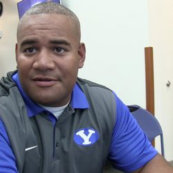 Defensive coordinator Ilaisa Tuiaki talks with the media during BYU Media Day at BYU Broadcasting in Provo on Thursday, June 30, 2016.