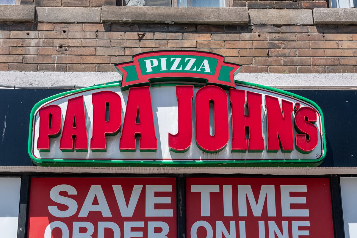 Sign of a Papa John’s Pizzeria in the downtown district.