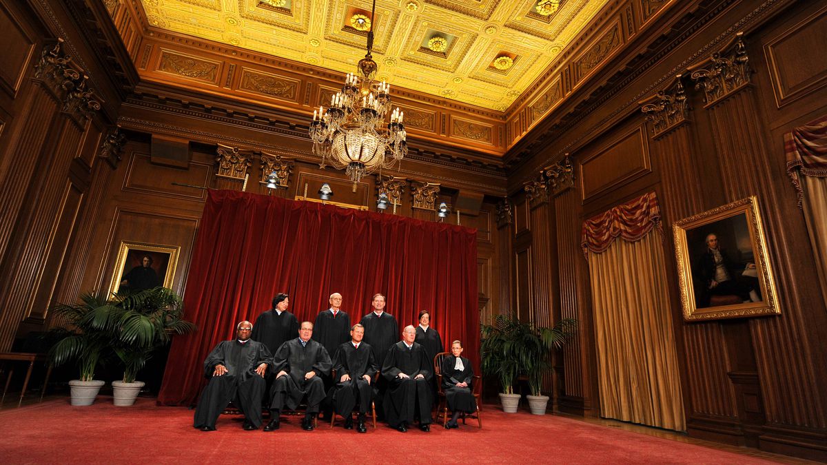 The justices of the Supreme Court sit for their 2010 portrait.