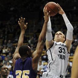 BYU forward Nate Austin (33) shoots over the defense of Prairie View A&M Panthers center Reggis Onwukamuche (35) during a game at the Marriott Center in Provo on Wednesday, Dec. 11, 2013.