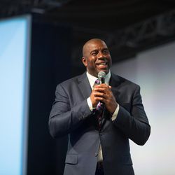 Former NBA legend Earvin "Magic" Johnson speaks to the attendees of Domopalooza. Johnson was one of the keynote speakers at Domopalooza. The event is being held at the Grand America hotel in Salt Lake City, Utah, March 21-25, 2016.
