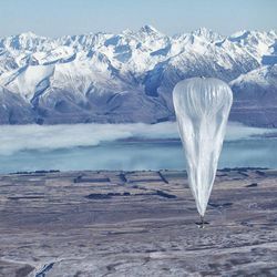 In this June 10, 2013 photo released by Jon Shenk, a Google balloon sails through the air with the Southern Alps mountains in the background, in Tekapo, New Zealand. Google is testing the balloons which sail in the stratosphere and beam the Internet to Earth. 