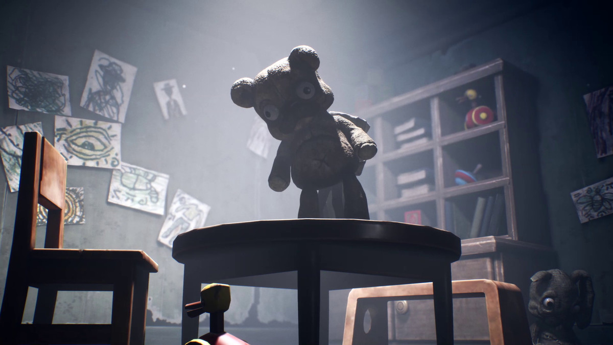 A teddy bear sits on top of a table in Little Nightmares 2