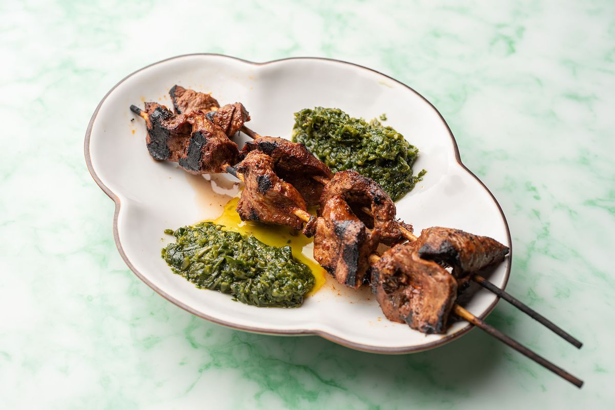 Skewered beef heart with a cilantro and serrano chile sauce.