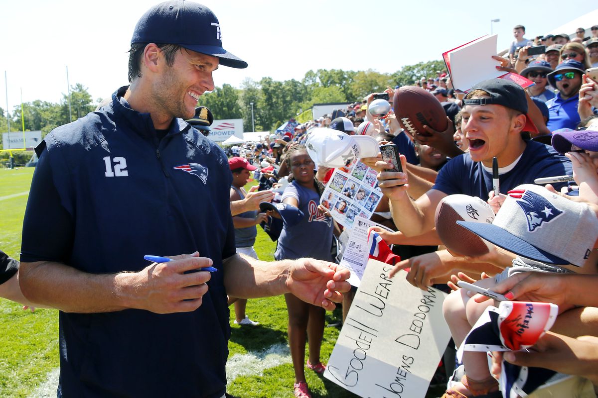 Tom Brady signs autographs after practice