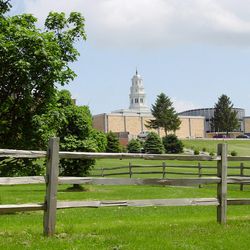 A view of the Joseph Smith Academy building blocking the view of the Nauvoo Temple in 2004