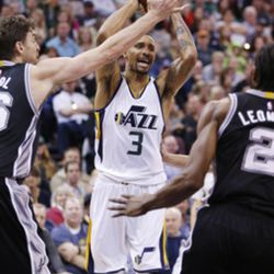 Utah Jazz guard George Hill (3) drive son San Antonio Spurs center Pau Gasol (16) during NBA action in Salt Lake City on Friday, Nov. 4, 2016. The Spurs won 100-86.  