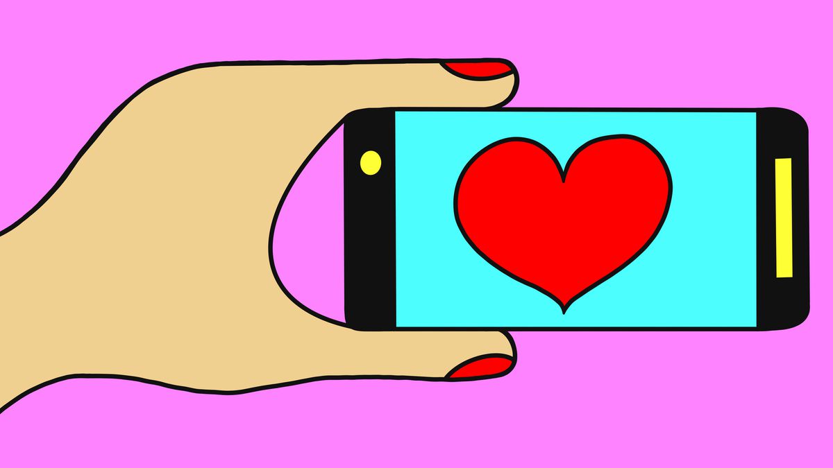 Hand holding phone with heart