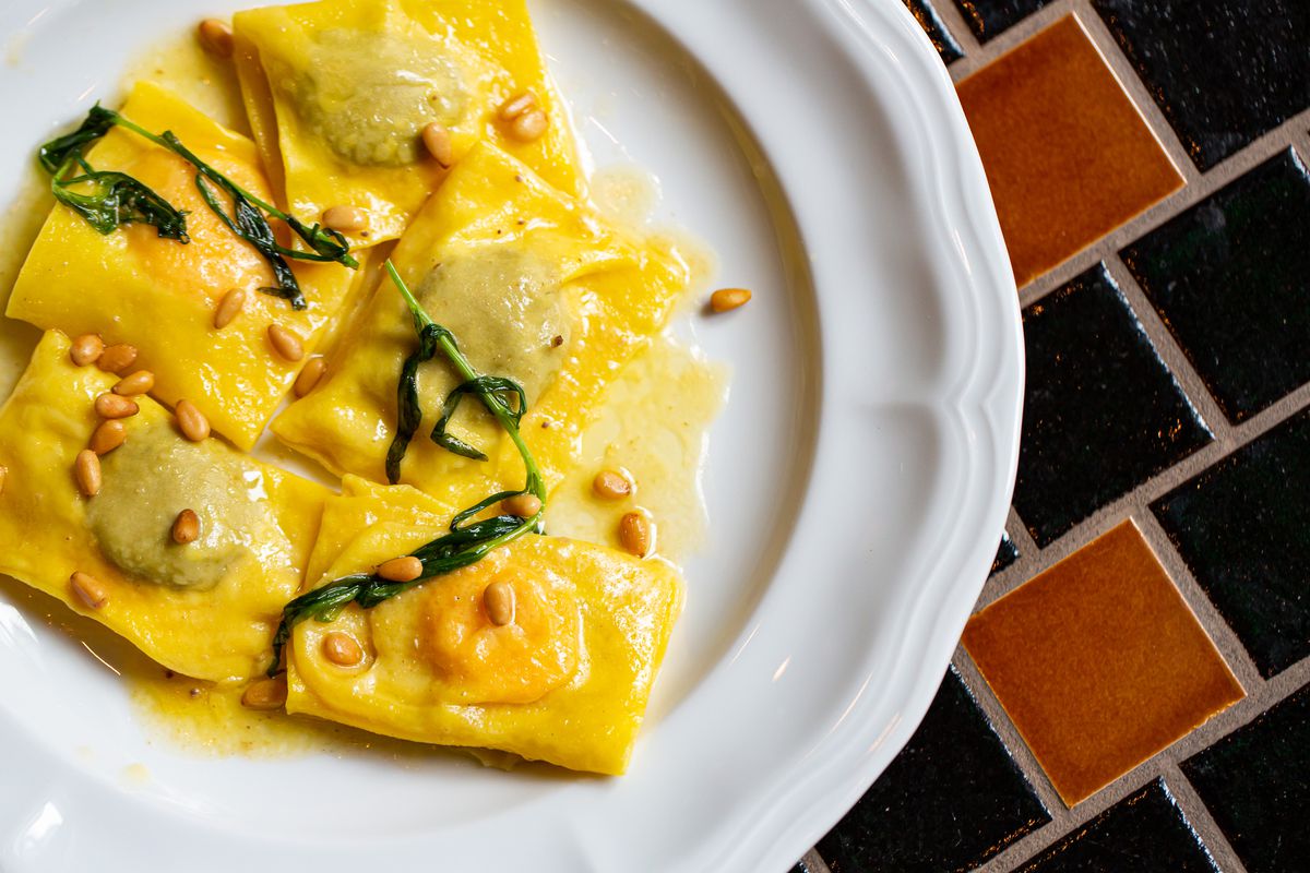 A plate of six double ravioli stuffed with chicken liver and sweet potato puree