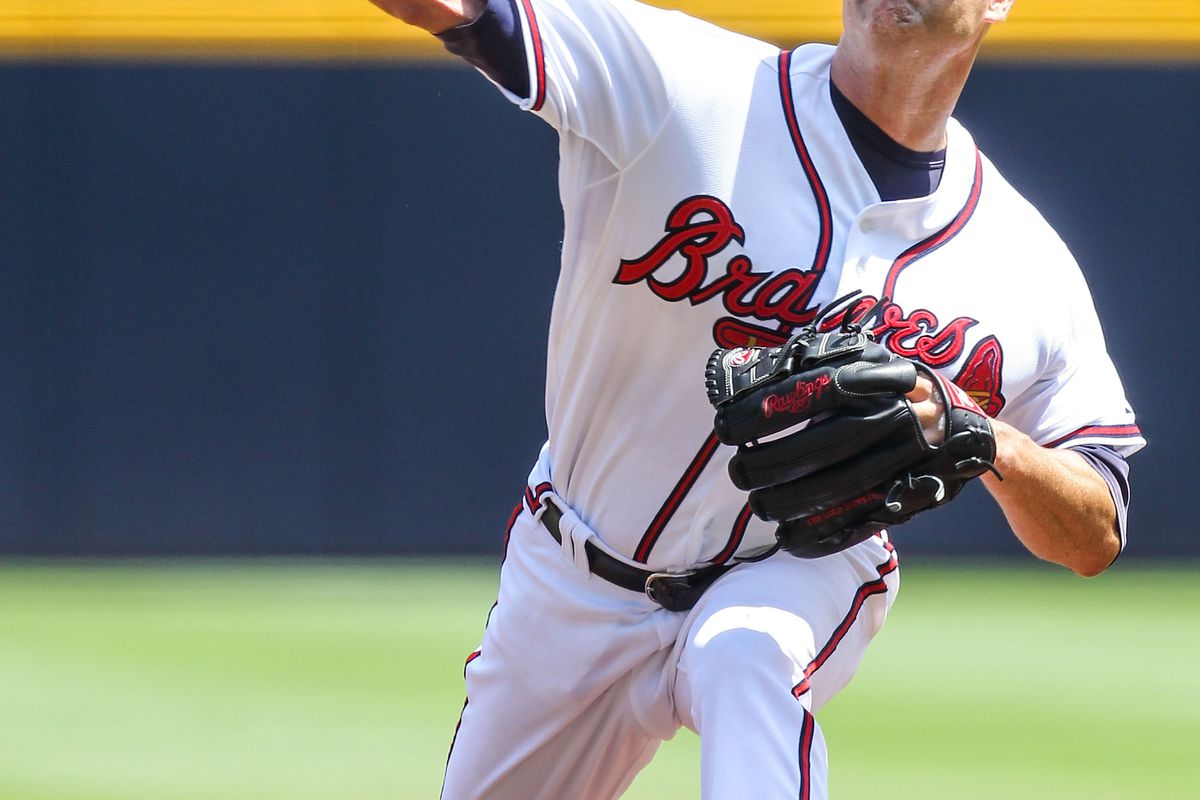 July 19, 2012; Atlanta, GA, USA; Atlanta Braves starting pitcher Tim Hudson (15) throws his 15th pitch of the game in the fifth inning against the San Francisco Giants at Turner Field. Mandatory Credit: Daniel Shirey-US PRESSWIRE