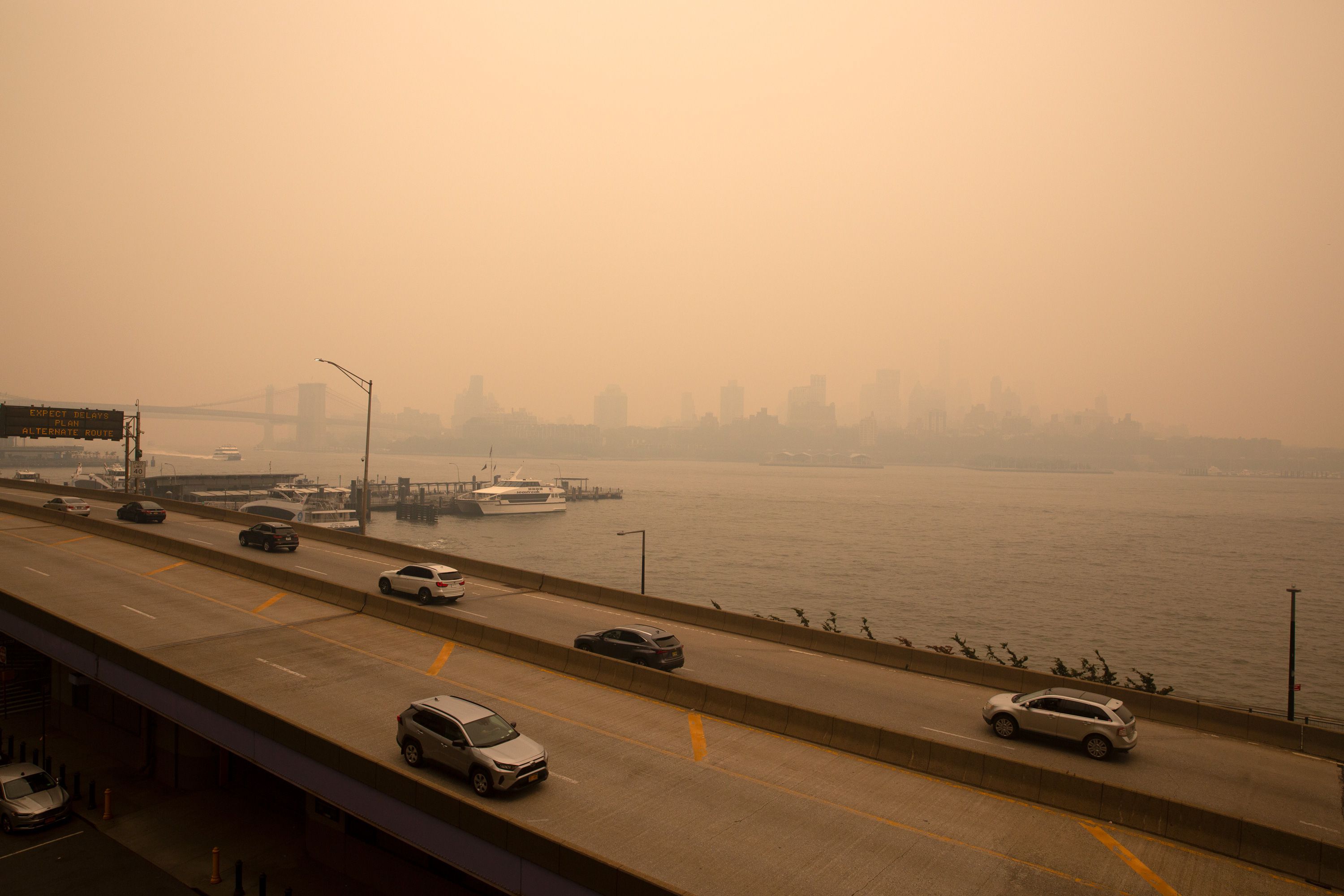 Smoke from Canadian wildfires settled over Lower Manhattan and Brooklyn.