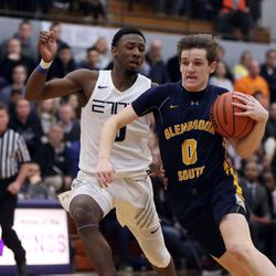 Glenbrook South’s Jimmy McMahon (0) drives around Evanston’s Jaylin Gibson (0) in Skokie Tuesday, March 5, 2019. | Kevin Tanaka/For the Sun Times