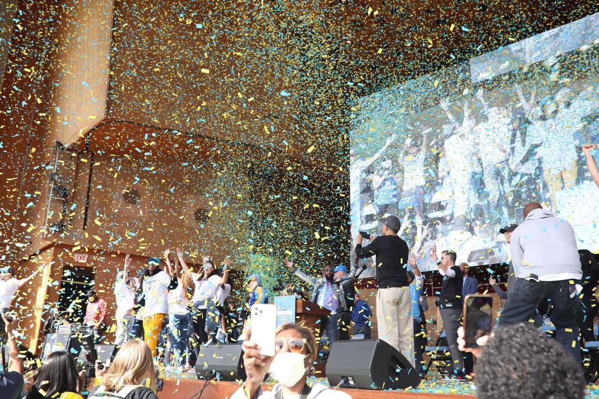 Players and fans start the celebration at the Pritzker Pavilion. 