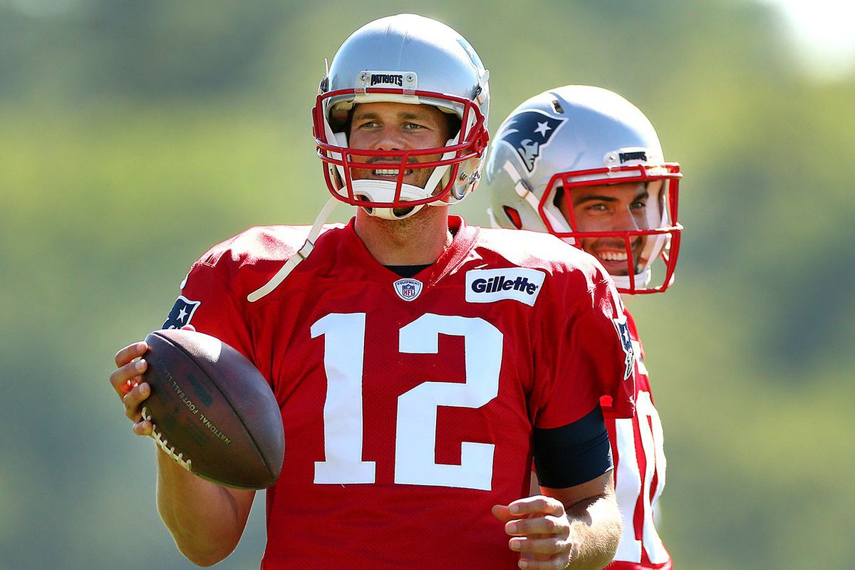 Tom Brady and Jimmy Garoppolo (The Boston Globe via Getty Images)