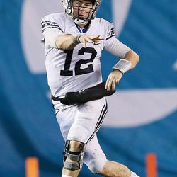 Brigham Young Cougars quarterback Tanner Mangum (12) throws during the Poinsettia Bowl in San Diego on Wednesday, Dec. 21, 2016. BYU won 24-21.