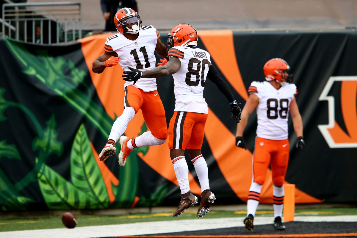 Cleveland Browns wide receiver Donovan Peoples-Jones (11), left, celebrates a go-ahead touchdown catch with Cleveland Browns wide receiver Jarvis Landry (80) during the fourth quarter of a Week 7 NFL football game against the Cincinnati Bengals, Sunday, Oct. 25, 2020, at Paul Brown Stadium in Cincinnati.
