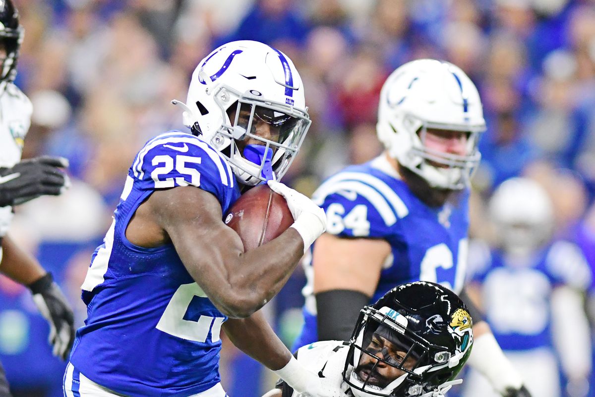 Indianapolis Colts running back Marlon Mack carries the ball as Jacksonville Jaguars corner back D.J. Hayden defends in the first half at Lucas Oil Stadium.