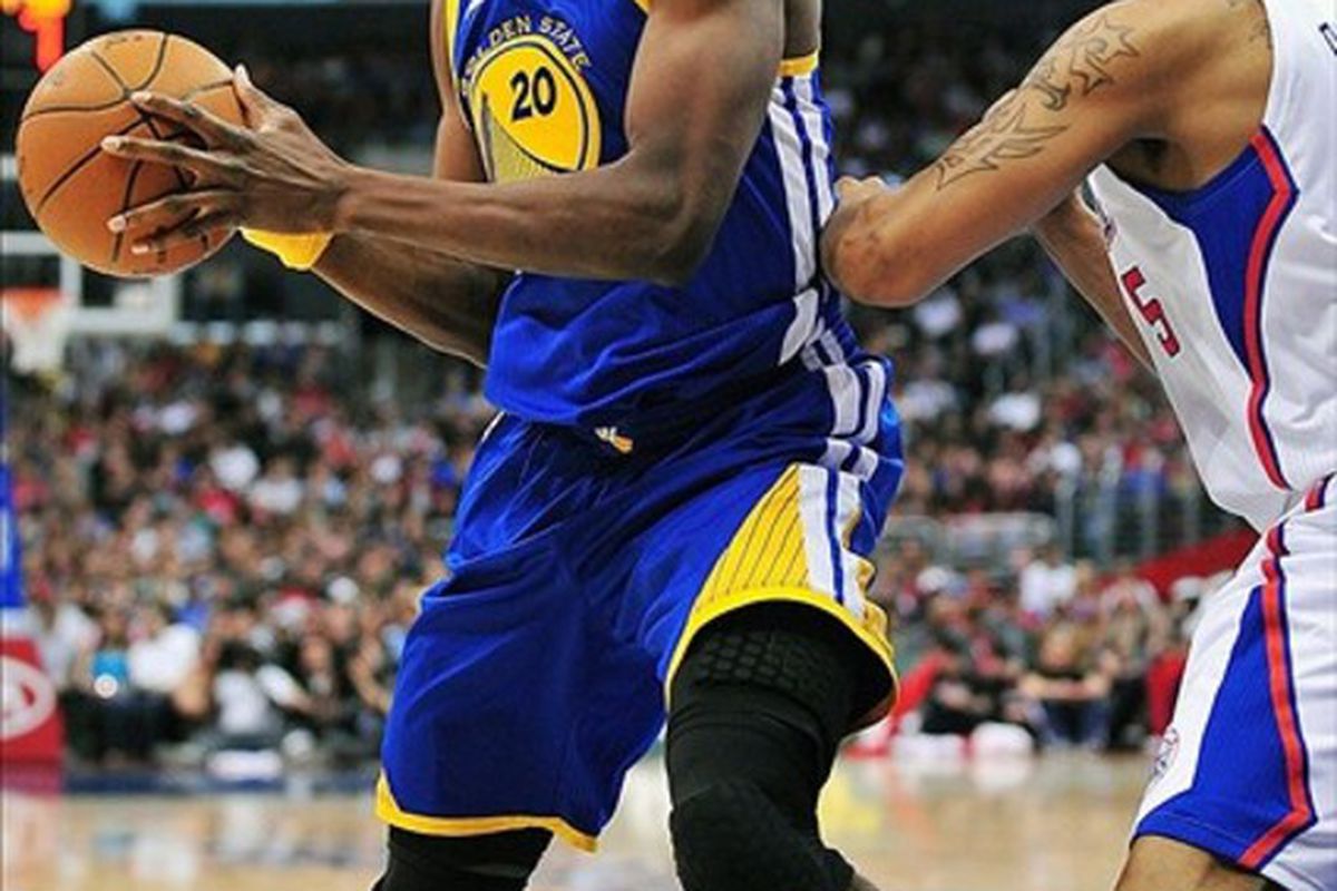 March 11, 2012; Los Angeles, CA, USA; Golden State Warriors power forward Ekpe Udoh (20) moves to the basket against the Los Angeles Clippers during the first half at Staples Center. Mandatory Credit: Gary A. Vasquez-US PRESSWIRE