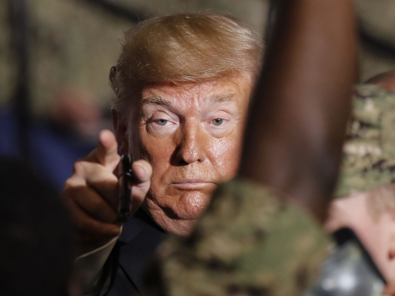 U.S. President Donald Trump gestures to U.S. servicemen at U.S. Navy multipurpose amphibious assault ship USS Wasp at the U.S. Navy’s Yokosuka base in Yokosuka, south of Tokyo Tuesday, May 28, 2019. 