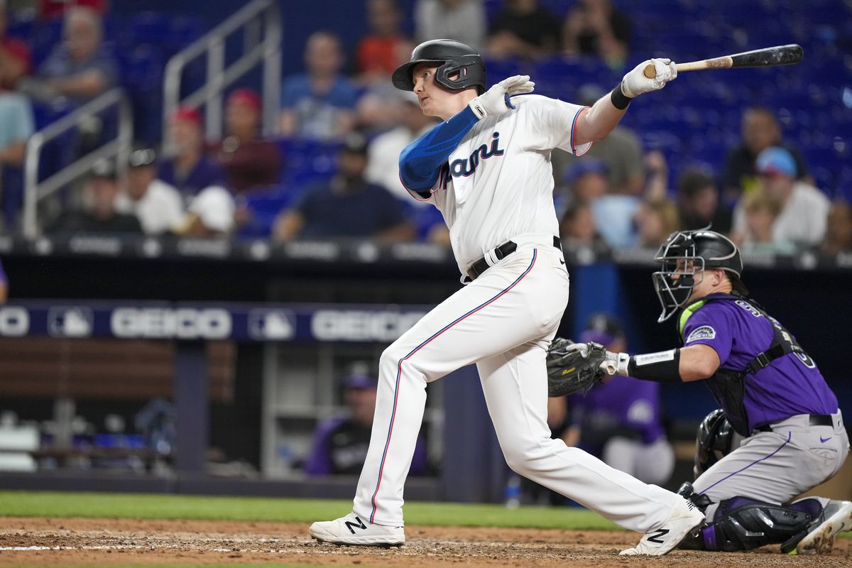 Garrett Cooper #26 of the Miami Marlins hits an RBI double in the eighth inning against the Colorado Rockies at loanDepot park on June 21, 2022 in Miami, Florida.