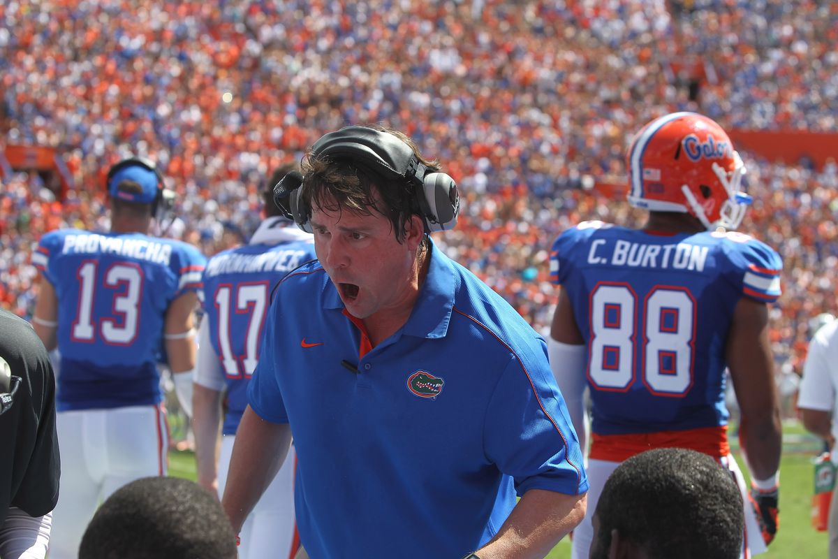 September 22, 2012; Gainesville FL, USA; Florida Gators head coach Will Muschamp talks with the players on the sidelines in the first half against the Kentucky Wildcats at Ben Hill Griffin Stadium. Mandatory Credit: Kim Klement-US PRESSWIRE