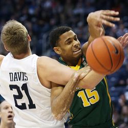 Brigham Young Cougars forward Kyle Davis (21) is whistled for a foul on San Francisco Dons forward Nate Renfro (15) as BYU and San Francisco play at the Marriott Center in Provo Saturday, Jan. 9, 2016. 