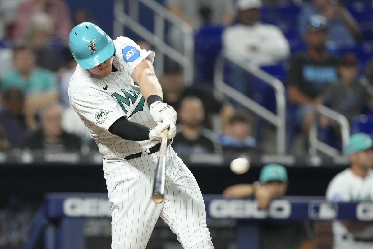 Garrett Cooper #26 of the Miami Marlins hits an RBI single in the fourth inning against the Arizona Diamondbacks at loanDepot park on April 14, 2023 in Miami, Florida.