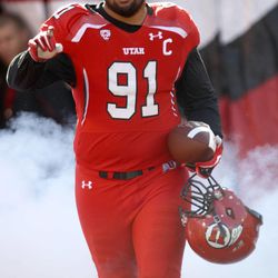 Senior Tenny Palepoi (91) walks onto the field before Utah plays Colorado in a football game on Senior Day at the Rice-Eccles Stadium in Salt Lake City on Saturday, Nov. 30, 2013.