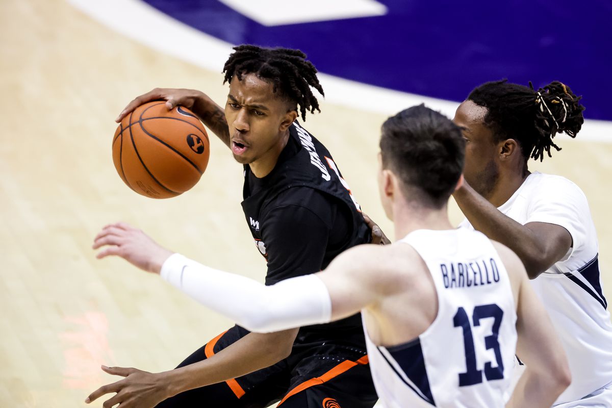 Pacific Tigers guard Daniss Jenkins (4) drives against Brigham Young Cougars guard Alex Barcello (13) and guard Brandon Averette (4) at the Marriott Center in Provo on Saturday, Jan. 30, 2021.