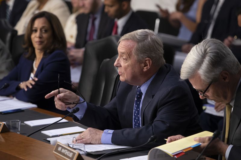 Sen. Dick Durbin, D-Ill., flanked by Sen. Kamala Harris, D-Calif. (left) and Sen. Sheldon Whitehouse, D-R.I., questions witnesses at a Senate Judiciary Committee hearing last year.