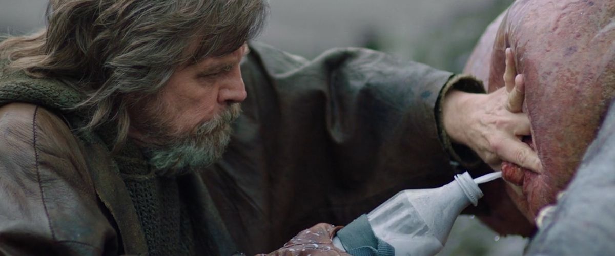 Shaggy old hermit Luke Skywalker (Mark Hamill) presses an alien boob to produce some greenish milk in Star Wars: Episode VIII – The&nbsp;Last Jedi
