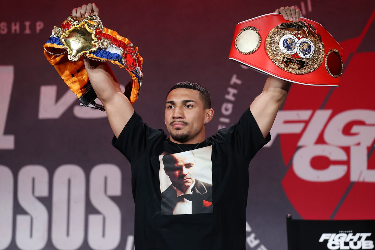 Teofimo Lopez poses with his championship belts during a press conference for Triller Fight Club at Mercedes-Benz Stadium on April 16, 2021 in Atlanta, Georgia ahead of his June 5 lightweight title fight against George Kambosos Jr.