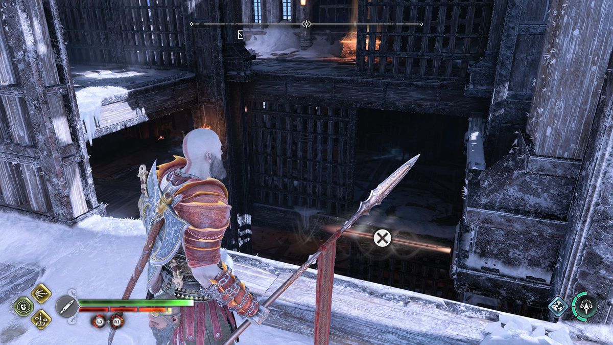 Kratos looks at a spear and gets ready to jump across a chasm in the prison in Niflheim in God of War Ragnarok.